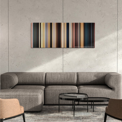 John Carter color palette canvas on a concrete wall above a gray sectional sofa