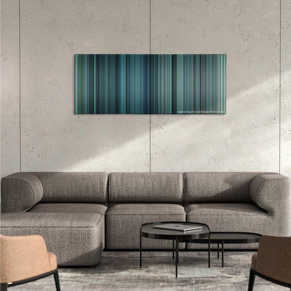 Non-Stop color palette canvas on a concrete wall above a gray sectional sofa
