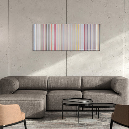 Super Size Me color palette canvas on a concrete wall above a gray sectional sofa