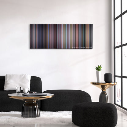 The Santa Clause color palette canvas above a black sofa with a gold-topped table