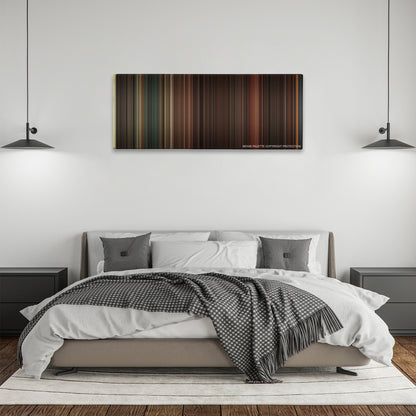 Inglourious Basterds color palette canvas above a bed, between two black pendant lamps