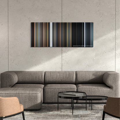 The 5th Wave color palette canvas on a concrete wall above a gray sectional sofa
