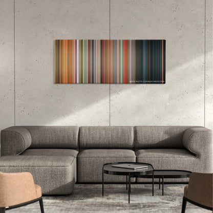 Friday color palette canvas on a concrete wall above a gray sectional sofa