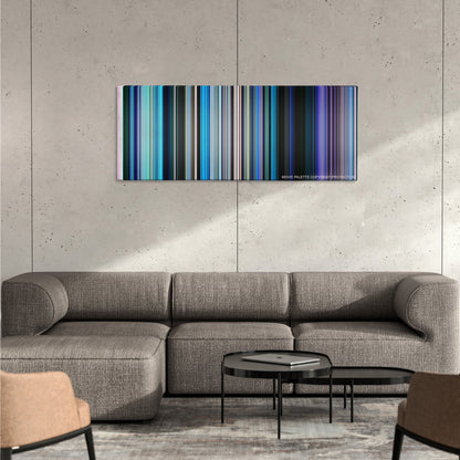 Finding Dory color palette canvas on a concrete wall above a gray sectional sofa