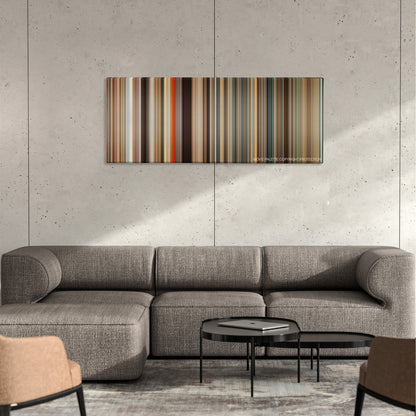 Gifted color palette canvas on a concrete wall above a gray sectional sofa