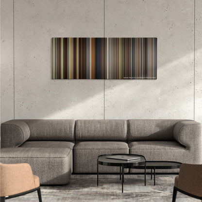 The Village color palette canvas on a concrete wall above a gray sectional sofa