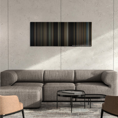 Lincoln color palette canvas on a concrete wall above a gray sectional sofa