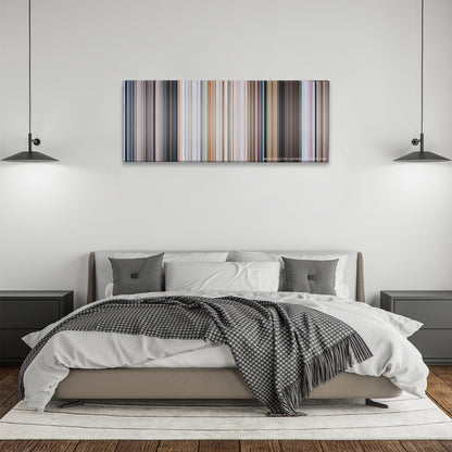 Superman II color palette canvas above a bed, between two black pendant lamps