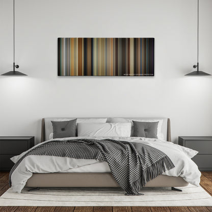 Get Out color palette canvas above a bed, between two black pendant lamps