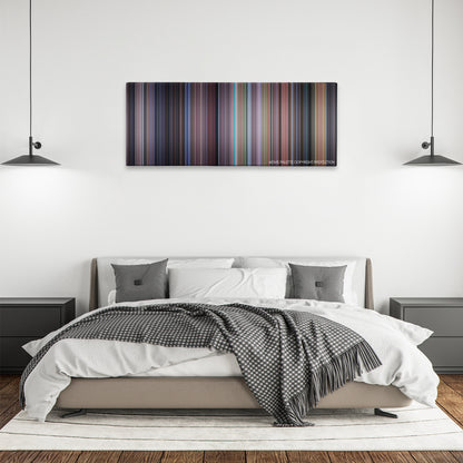The Santa Clause color palette canvas above a bed, between two black pendant lamps