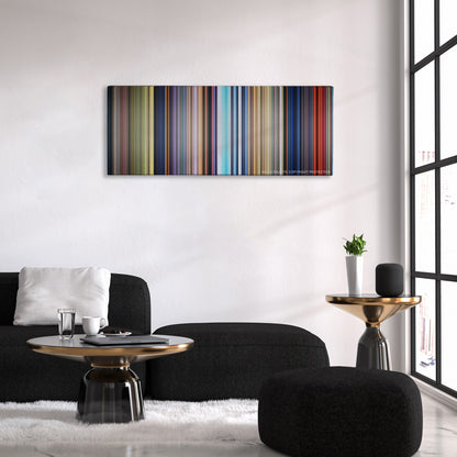 Bambi color palette canvas above a black sofa with a gold-topped table