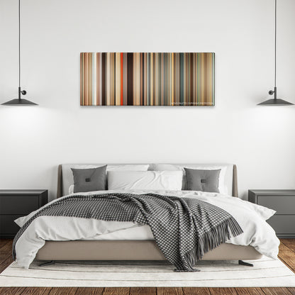 Gifted color palette canvas above a bed, between two black pendant lamps