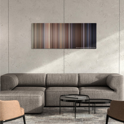 Dog Day Afternoon color palette canvas on a concrete wall above a gray sectional sofa
