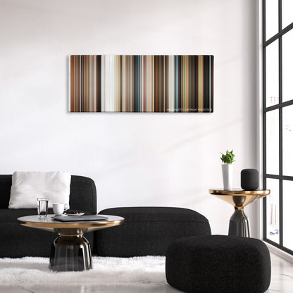 Downsizing color palette canvas above a black sofa with a gold-topped table