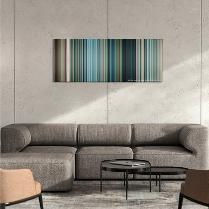 Battleship color palette canvas on a concrete wall above a gray sectional sofa