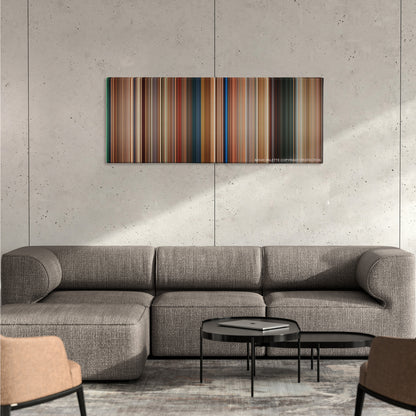 The Transporter color palette canvas on a concrete wall above a gray sectional sofa
