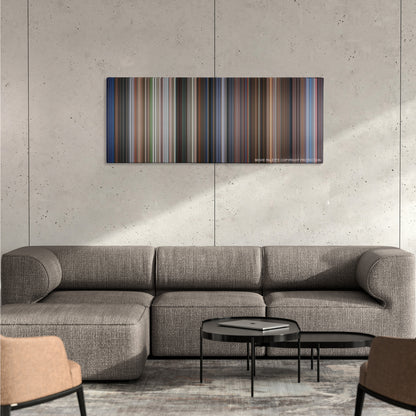 Rush Hour color palette canvas on a concrete wall above a gray sectional sofa