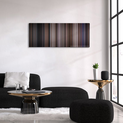 Ronin color palette canvas above a black sofa with a gold-topped table