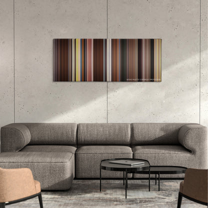 Movie 43 color palette canvas on a concrete wall above a gray sectional sofa