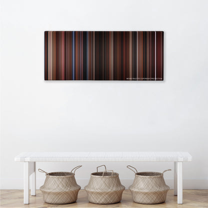 The Lost Boys color palette canvas above a white bench with three woven baskets