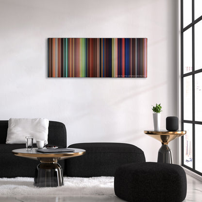 Tangled color palette canvas above a black sofa with a gold-topped table