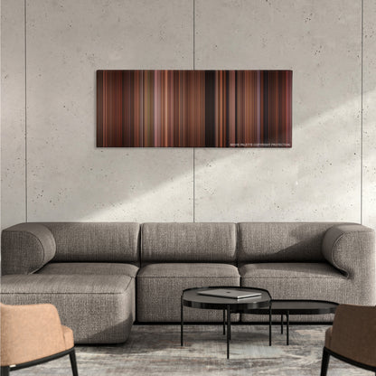 American Pie 2 color palette canvas on a concrete wall above a gray sectional sofa