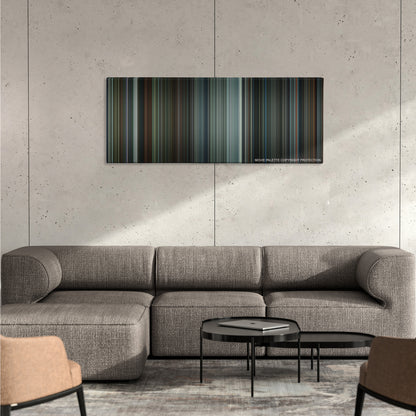 Total Recall color palette canvas on a concrete wall above a gray sectional sofa