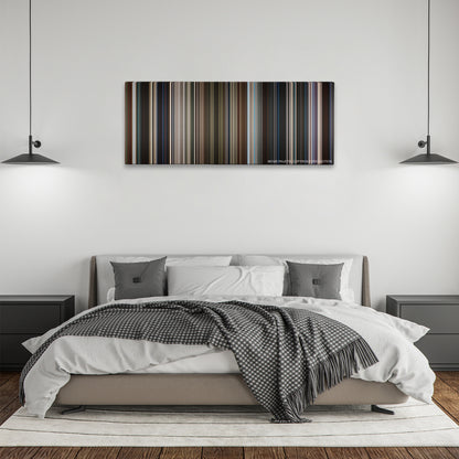 Captain Marvel color palette canvas above a bed, between two black pendant lamps