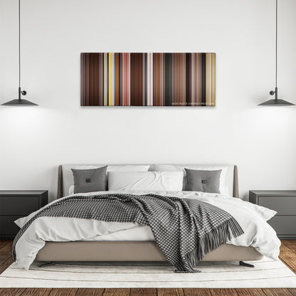 Movie 43 color palette canvas above a bed, between two black pendant lamps