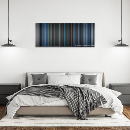 Sphere color palette canvas above a bed, between two black pendant lamps