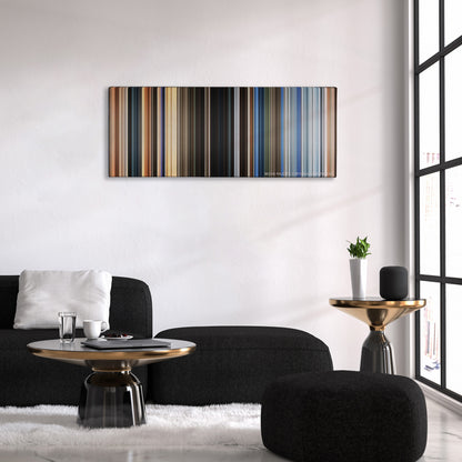 The Old Guard color palette canvas above a black sofa with a gold-topped table