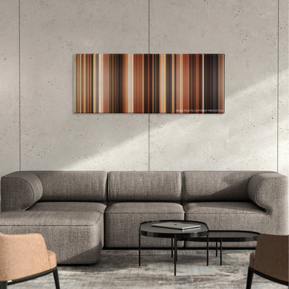 The Ladykillers color palette canvas on a concrete wall above a gray sectional sofa