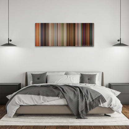 Enchanted color palette canvas above a bed, between two black pendant lamps