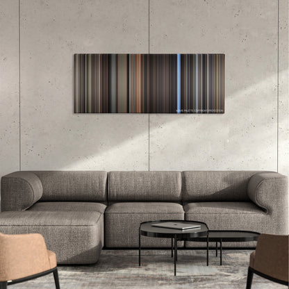 The Conversation color palette canvas on a concrete wall above a gray sectional sofa