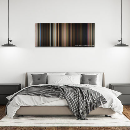 Alpha Dog color palette canvas above a bed, between two black pendant lamps
