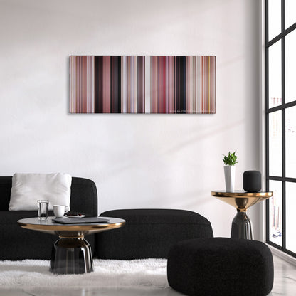 Grease color palette canvas above a black sofa with a gold-topped table