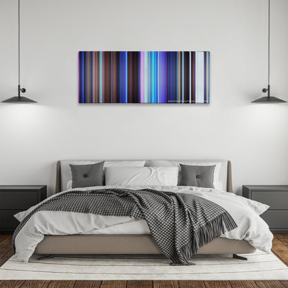 Frozen color palette canvas above a bed, between two black pendant lamps
