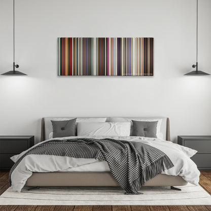 A Star Is Born color palette canvas above a bed, between two black pendant lamps