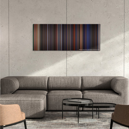 Das Boot color palette canvas on a concrete wall above a gray sectional sofa