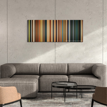 Paddington color palette canvas on a concrete wall above a gray sectional sofa