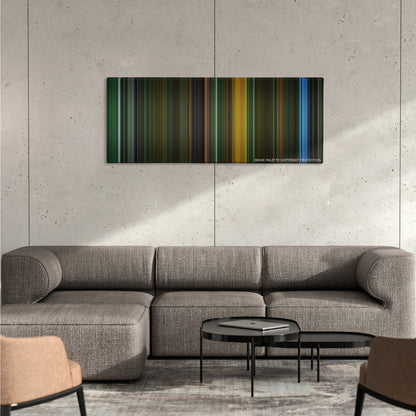 Saw II color palette canvas on a concrete wall above a gray sectional sofa