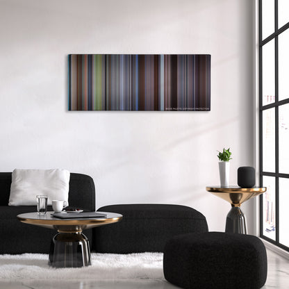 About a Boy color palette canvas above a black sofa with a gold-topped table