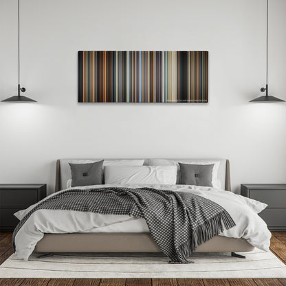 Crash color palette canvas above a bed, between two black pendant lamps