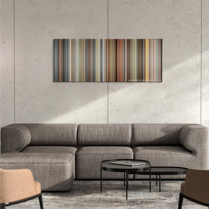 Crank color palette canvas on a concrete wall above a gray sectional sofa