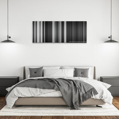 Frankenweenie color palette canvas above a bed, between two black pendant lamps