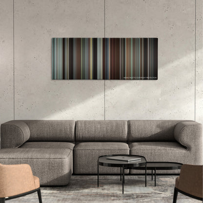 Wall Street: Money Never Sleeps color palette canvas on a concrete wall above a gray sectional sofa