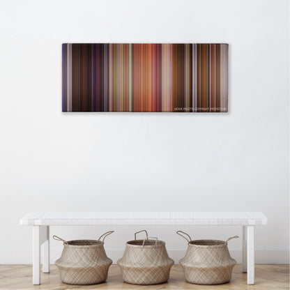 Bedazzled color palette canvas above a white bench with three woven baskets