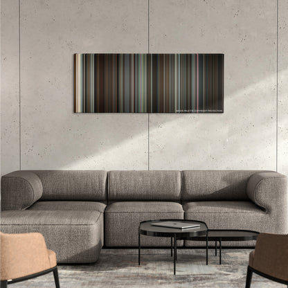 Valkyrie color palette canvas on a concrete wall above a gray sectional sofa