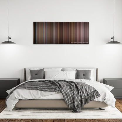 Four Rooms color palette canvas above a bed, between two black pendant lamps