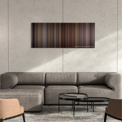 Four Rooms color palette canvas on a concrete wall above a gray sectional sofa